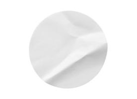 Blank white round paper sticker label isolated on white background photo