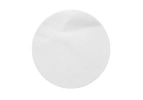 Blank white round paper sticker label isolated on white background photo