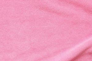 Pink towel fabric texture surface close up background photo