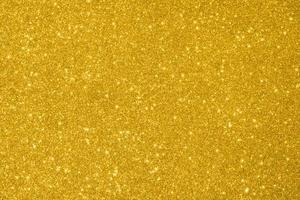 Abstract gold glitter sparkle background photo