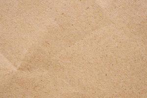 Brown paper eco recycled kraft sheet texture cardboard background photo