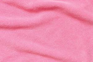 Pink towel fabric texture surface close up background photo