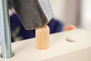 Man assembling furniture at home photo