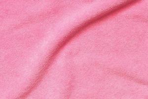 Pink towel fabric texture surface close up background photo