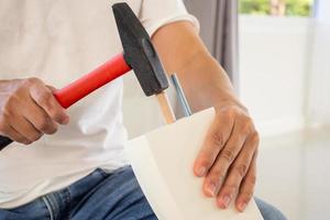 Man assembling furniture at home photo