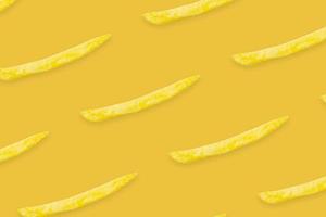 french fries pattern on yellow background top view flat lay photo