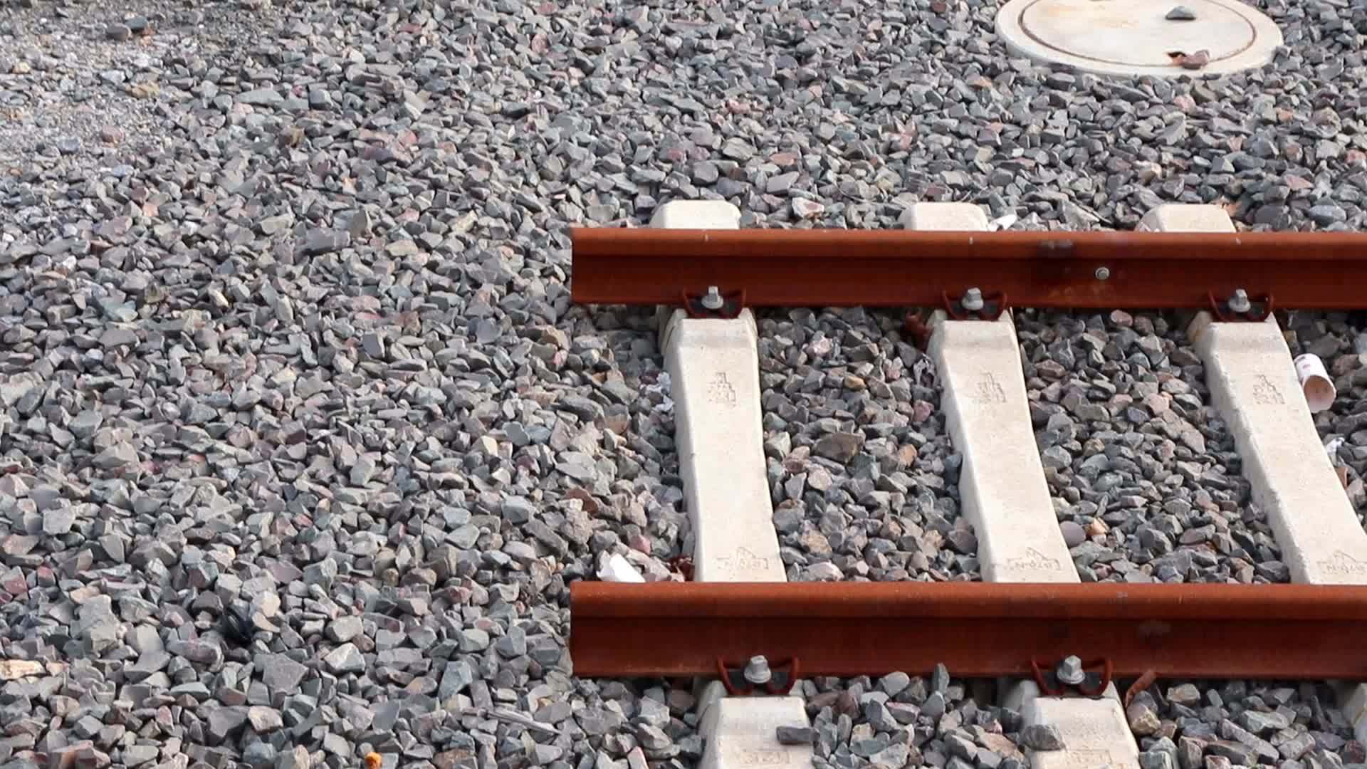 Rusty railway end in urban train station shows end of way in railway