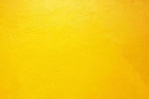 Yellow concrete wall texture background photo