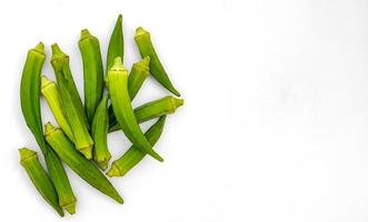 Raw okra or ladyfingers isolated on white background photo