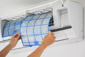 man hand hold air conditioner filter cleaning concept photo