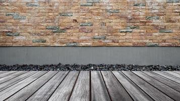 Empty wood floor with brick wall background photo
