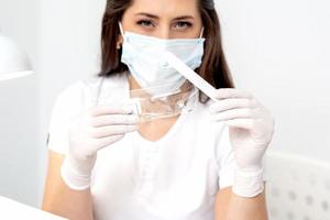 Woman holding medical tool. photo