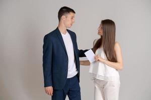 Business partners are happy to receive an important document. Man in blue suit photo