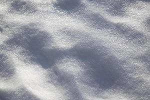 antecedentes. paisaje de invierno la textura de la nieve foto