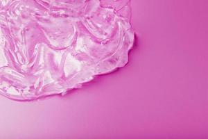 Transparent Gel on a pink background with free space. photo