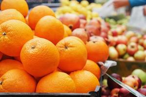 Oranges in the market close-up on the market counter. photo