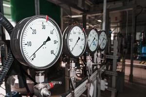 Pressure gauge is a close-up pressure measuring device in a row. photo