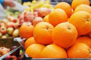 Oranges in the market close-up on the market counter. photo