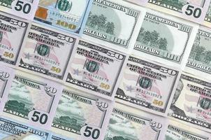 Many one hundred and fifty dollar bills on flat background surface close up. Flat lay top view photo