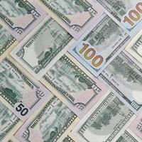 Many one hundred and fifty dollar bills on flat background surface close up. Flat lay top view photo