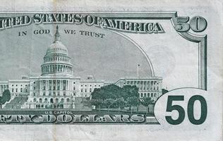 US Capitol on 50 dollars banknote back side closeup macro fragment. United states fifty dollars money bill photo