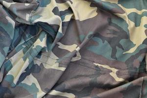 Camouflage background texture as backdrop for paintball and airsoft strikeball design projects photo