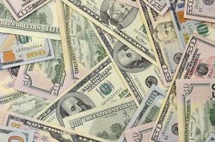 Many one hundred and fifty dollar bills on flat background surface close up. Flat lay top view photo