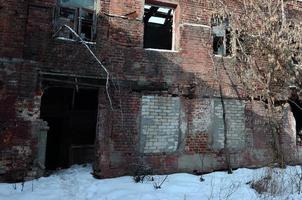 Fragment of an abandoned two-story building after military operations in Donetsk photo