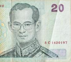 King Bhumibol Adulyadej on 20 Baht Thailand money bill close up photo