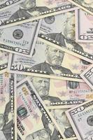 Many US fifty dollar bills on flat background surface close up. Flat lay top view. Abstract business concept photo