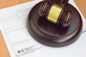 Justice mallet and W-2 Wage and tax Statement form from IRS