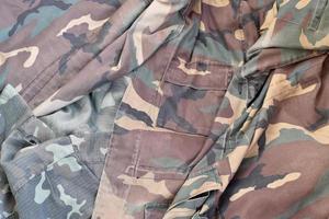 Camouflage background texture as backdrop for hunting or fishing design projects photo