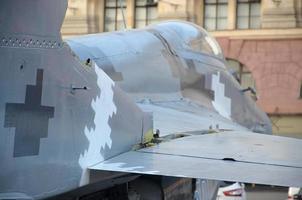 Old fighter aircraft painted in grey camouflage shapes with many rivets photo