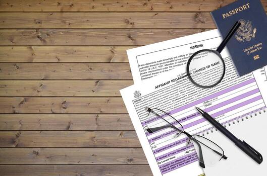 Department of State form DS60 Affidavit Regarding a change of name lies on table and ready to fill. Paperwork during operations with US Passport concept photo