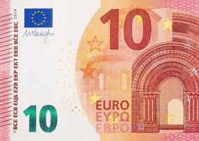 Fragment part of 10 euro banknote close-up with small red details photo