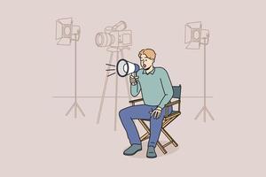 Film producer sitting on chair screaming in megaphone at shooting. Man movie director with loudspeaker manage scene. Vector illustration.