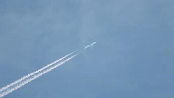 Airplane flies in sky. Large airliner with passengers on blue sky. Travelling and tourism concept. video