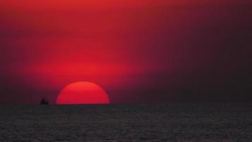 Sunset over ocean landscape, Nai Harn beach, Phuket Island, Thailand, telephoto lens. video