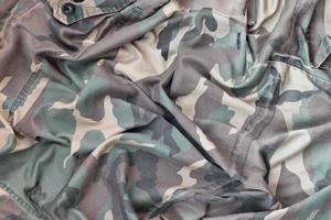 Camouflage background texture as backdrop for military video games and design projects photo