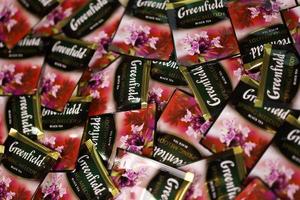 KHARKOV, UKRAINE - DECEMBER 8, 2020 Greenfield Spring Melody tea bags. Greenfield manufactured by Orimi Trade and Greenfield Tea ltd. photo