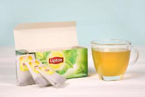 KHARKOV, UKRAINE - DECEMBER 8, 2020 Lipton classic green tea bags. Lipton is a British brand of tea owned by Unilever and PepsiCo photo