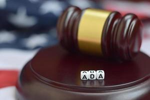 Justice mallet and ADA acronym. Americans with disabilities act photo