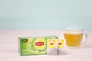 KHARKOV, UKRAINE - DECEMBER 8, 2020 Lipton classic green tea bags. Lipton is a British brand of tea owned by Unilever and PepsiCo photo