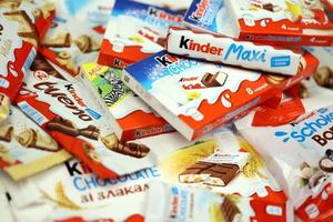 KHARKOV, UKRAINE - DECEMBER 8, 2020 Many different products by Kinder brand made by Ferrero SpA. Kinder is a confectionery product brand line of Italian manufacturer Ferrero photo
