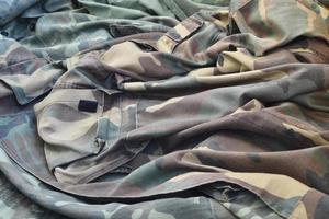 Camouflage background texture as backdrop for army and military design projects photo