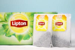 KHARKOV, UKRAINE - DECEMBER 8, 2020 Lipton classic green tea bags. Lipton is a British brand of tea owned by Unilever and PepsiCo photo