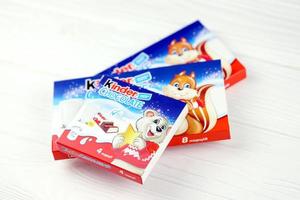 Kinder small Chocolate bars in paper wrappings made by Ferrero SpA. Kinder is a confectionery product brand line of Italian multinational manufacturer Ferrero photo