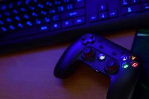 Gamesir g3s video game controller and a4tech keyboard on office table photo