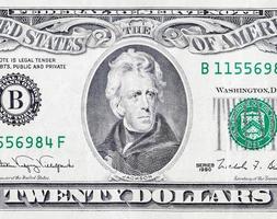 Portrait of US president Andrew Jackson on 20 dollars banknote closeup macro fragment photo
