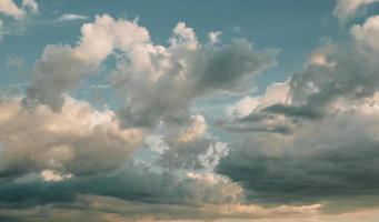 Clouds at sunset, summer sky background, evening cloudscape photo